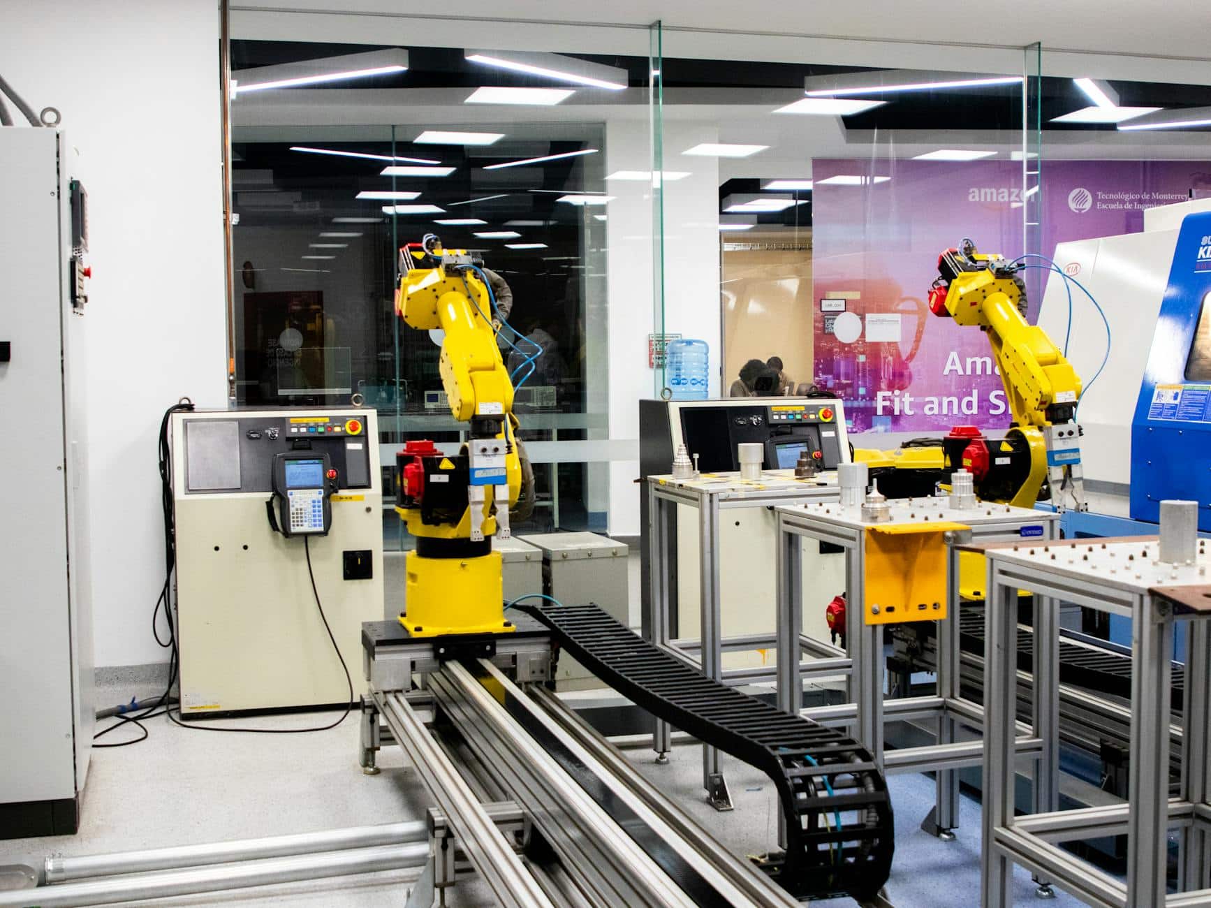 Multiple robotic arms on production line - industrial robot maintenance costs at scale