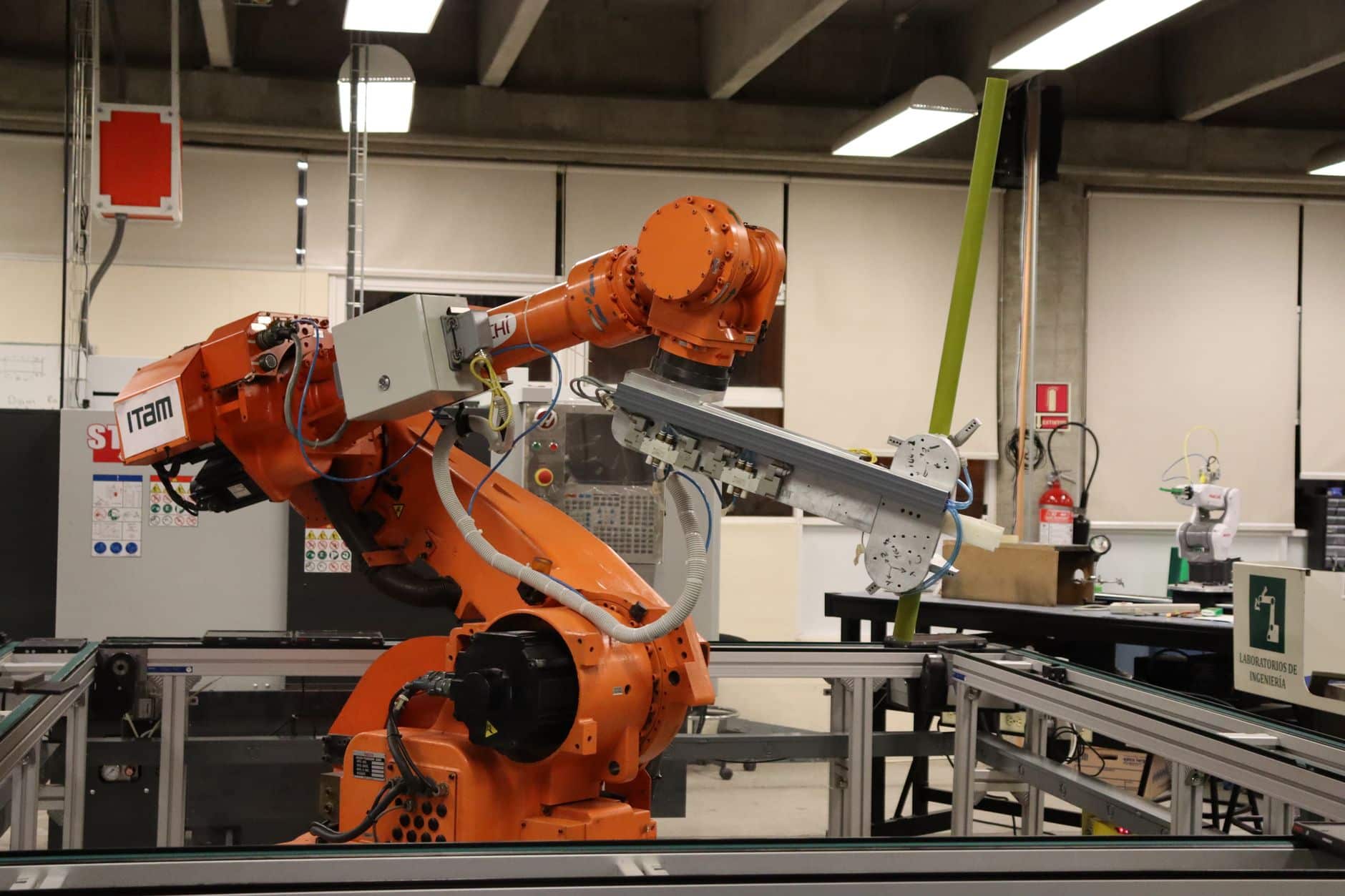 Articulated six-axis industrial robot arm with joints needing protective covers