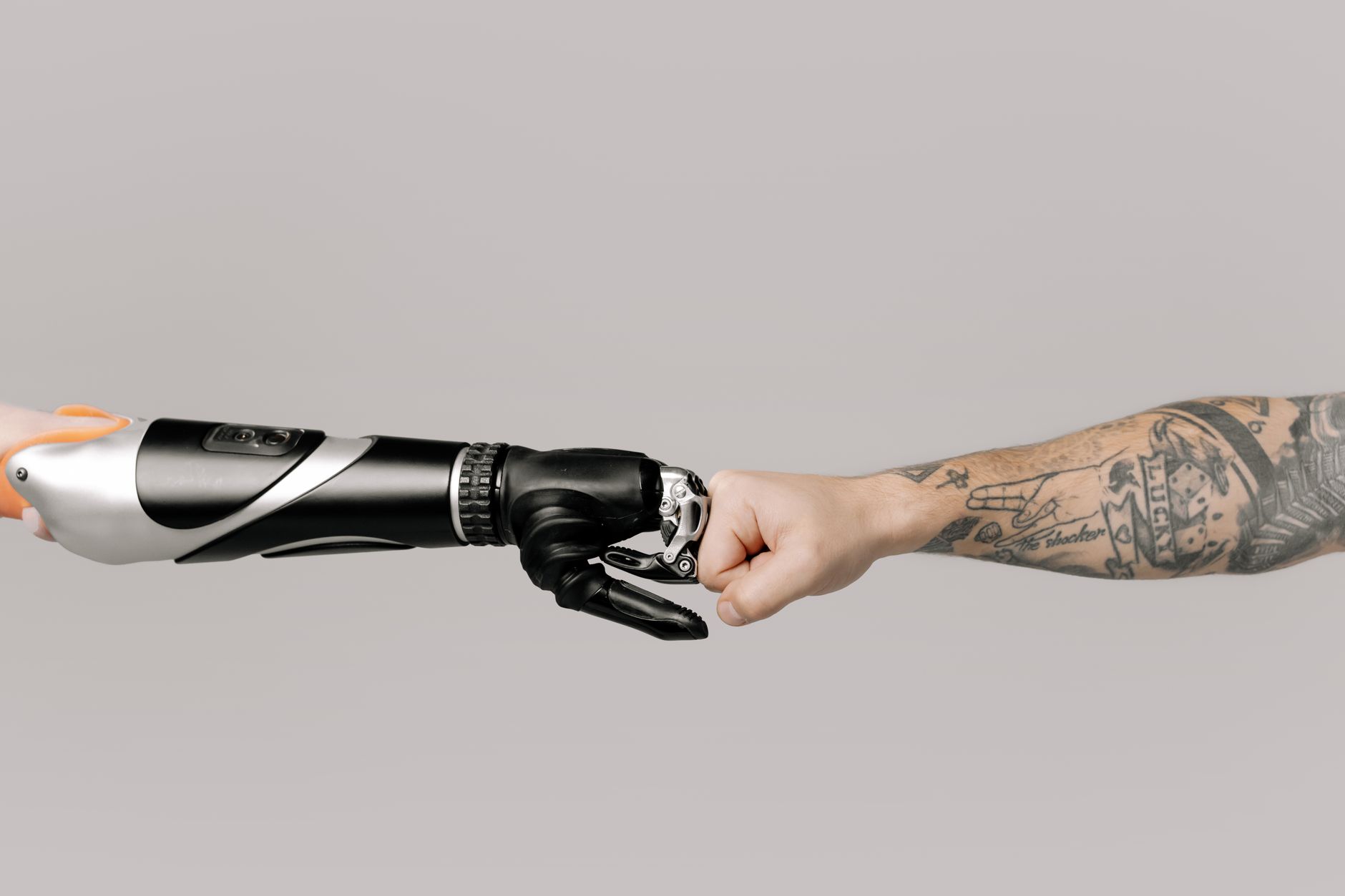 Collaborative robot arm working next to an operator with lightweight protection