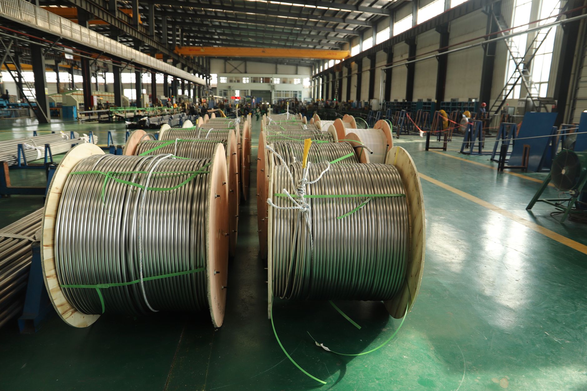 Industrial cable reels similar to those used for robot dress pack cable and hose protection