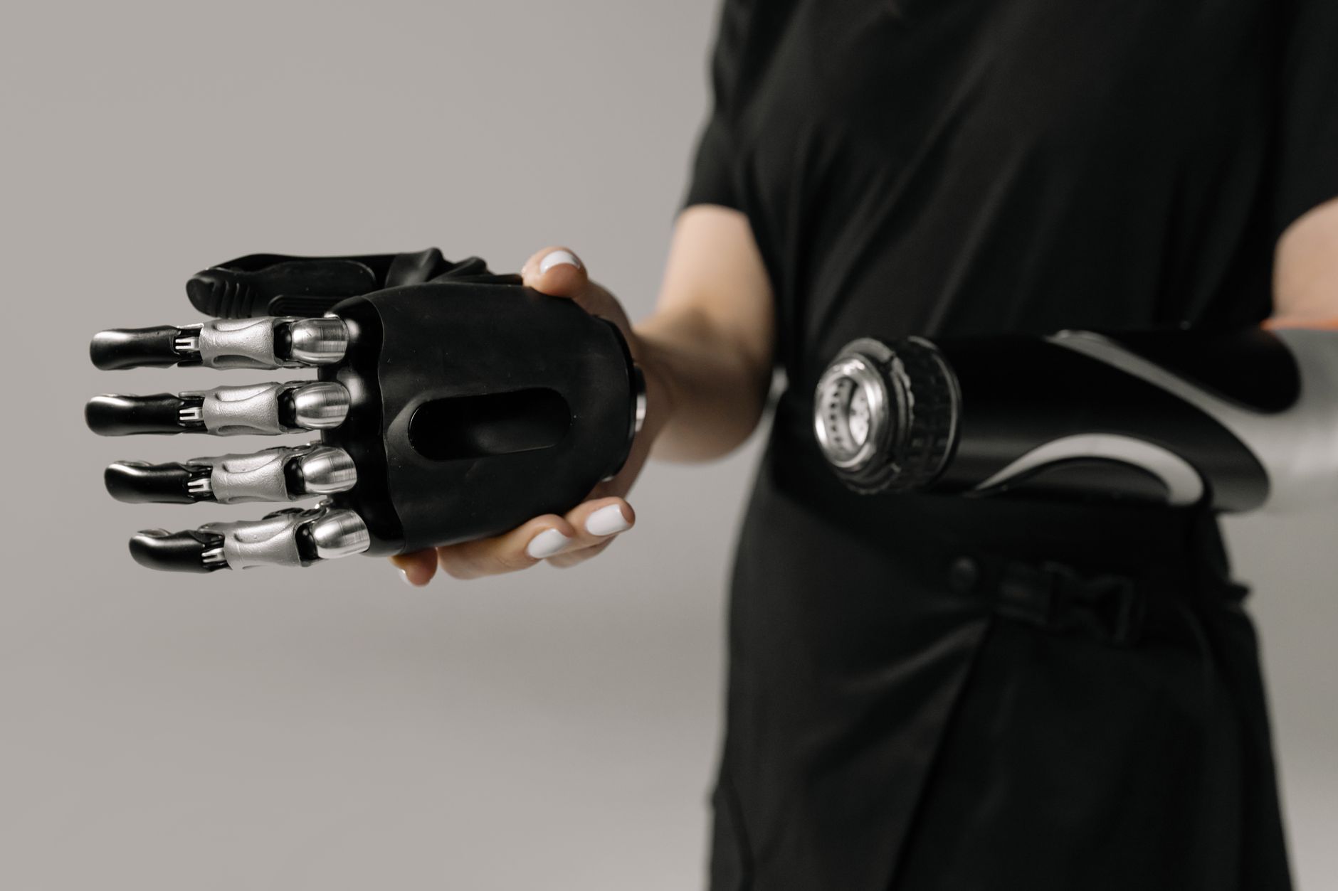 Robot joint at full travel, the range an arm cover must not restrict