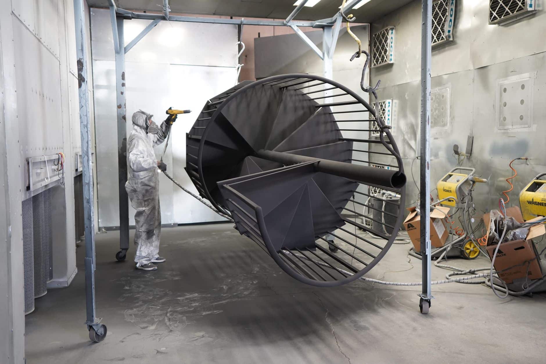 Robot working in a paint environment where covers wear fastest