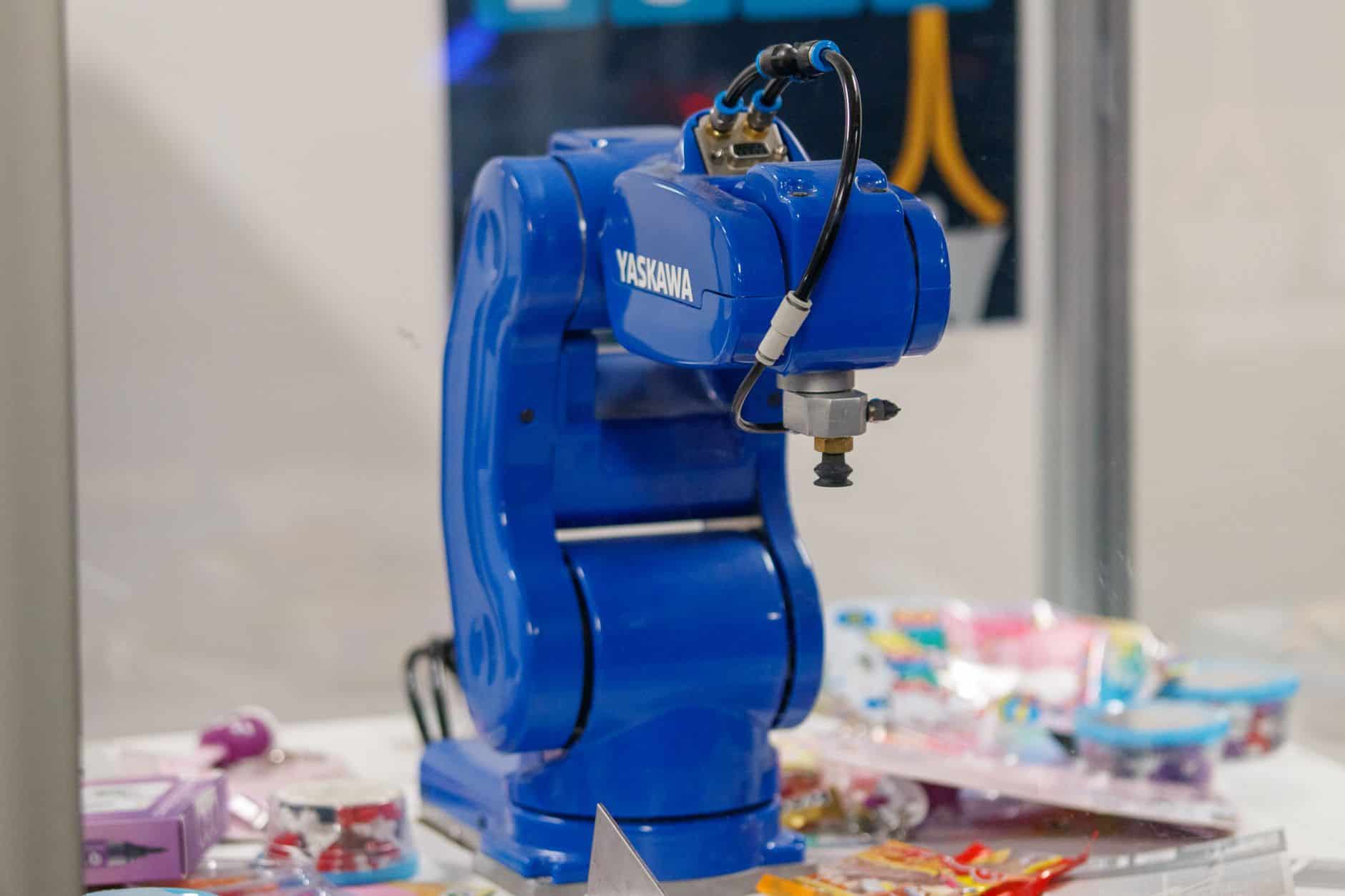 Close-up of a cable and hose bundle following a robot axis