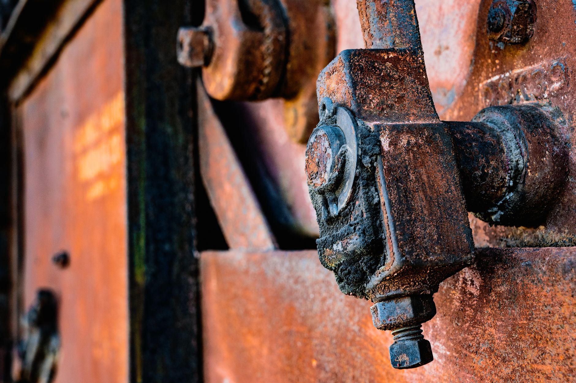 Corrosion on the metal frame of a machine stored outdoors without adequate cover
