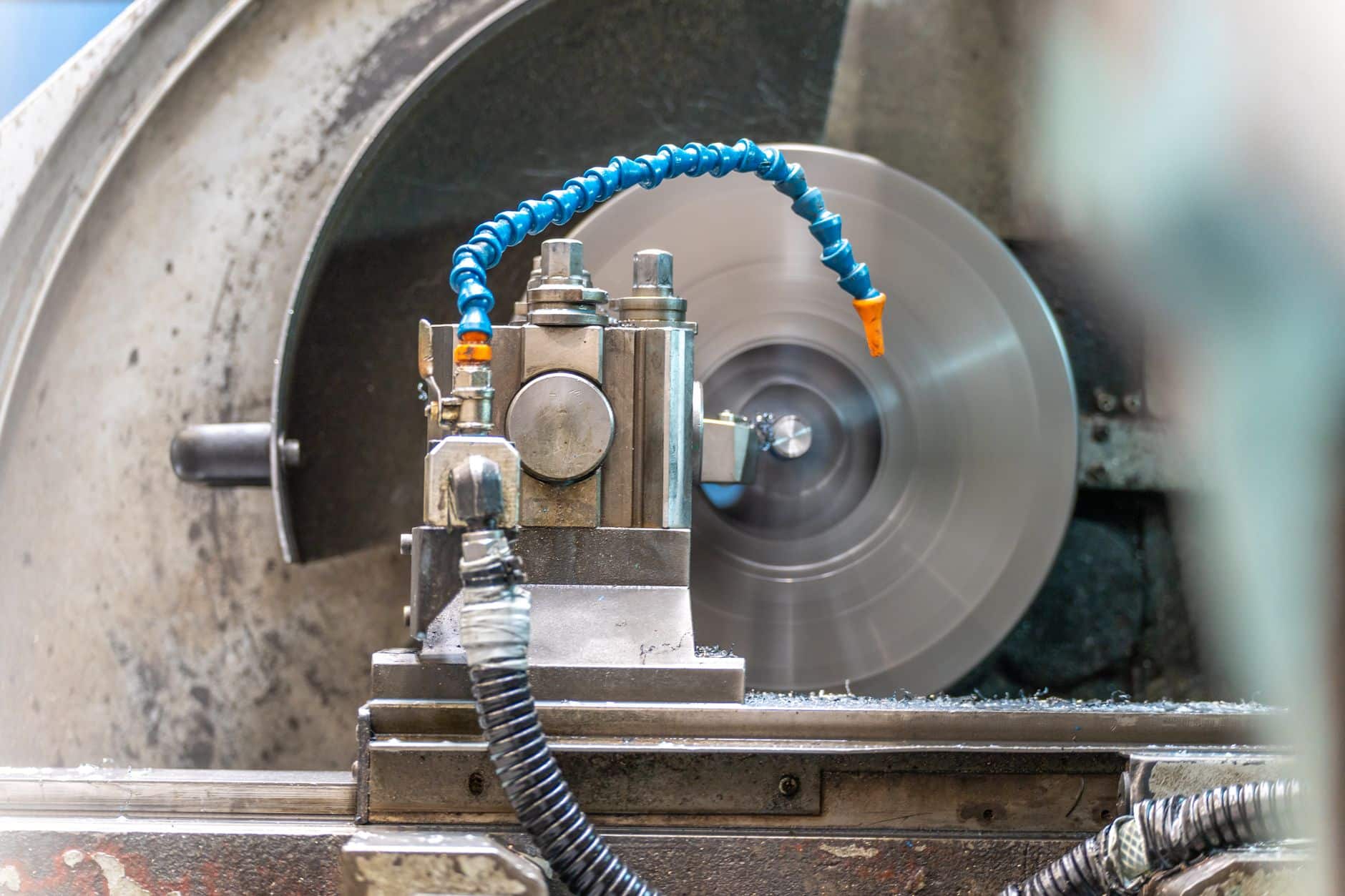 Bundle of industrial hoses routed on a machine, the kind of run a hose protection sleeve covers